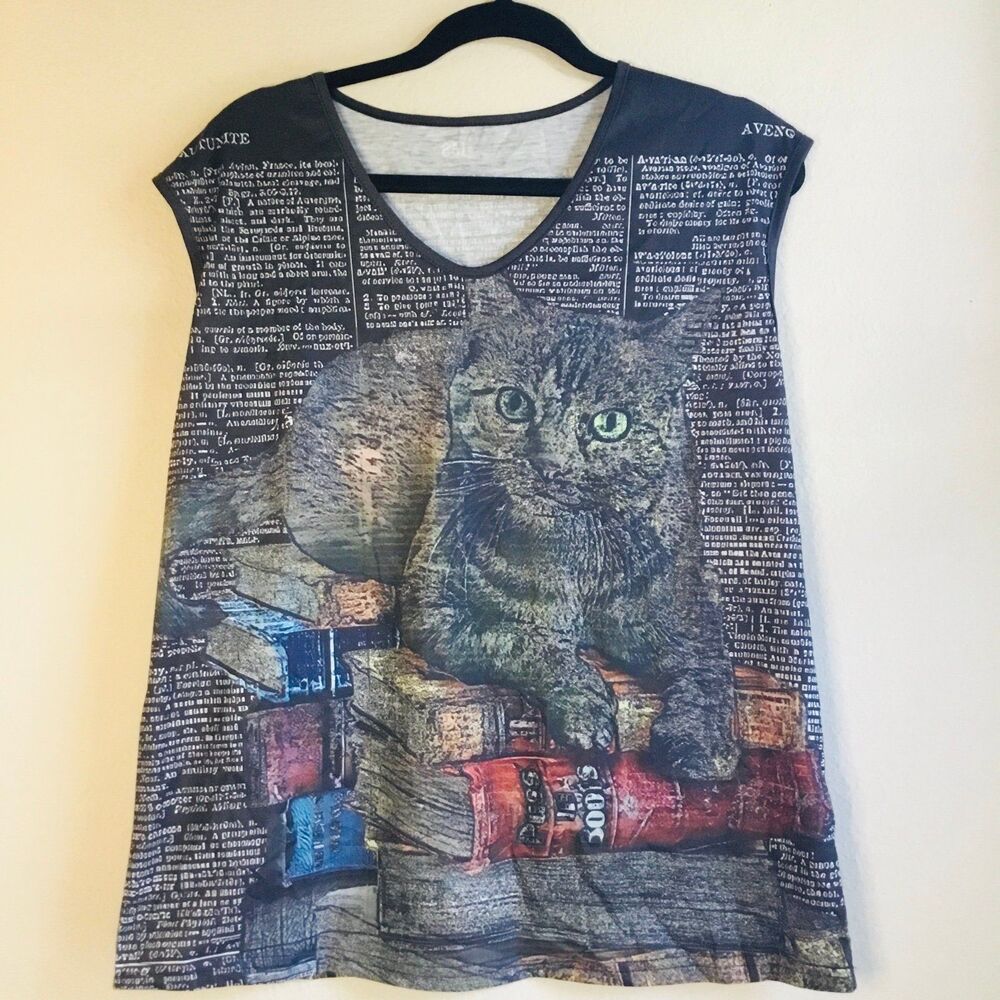 Tabby cat with green eyes on top of books top all over print witchy witchcore